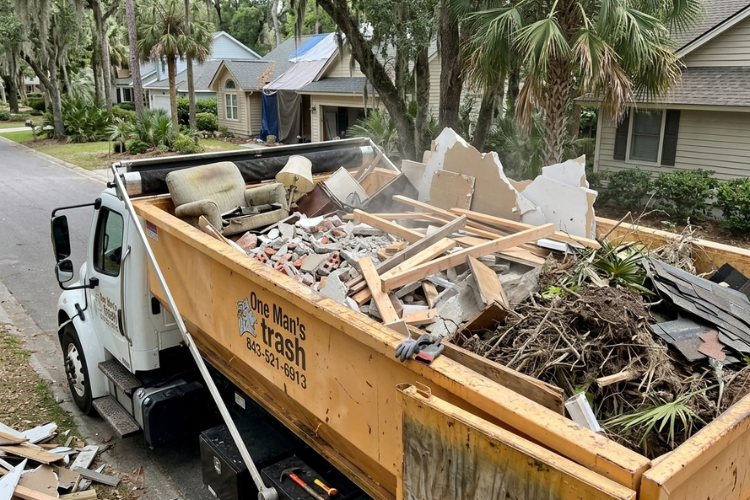 17-yard roll-off dumpster rental by One Man's Trash filled with construction debris, wood, drywall, and renovation materials during a home remodeling project in Hilton Head Island, South Carolina.