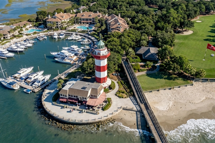 Aerial view of Harbour Town Lighthouse and marina in Hilton Head Island, South Carolina, one of the service areas covered by One Man's Trash dumpster rental and debris removal services.